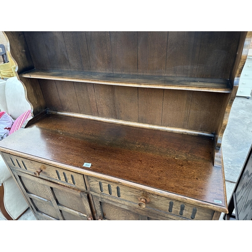 2944 - A REPRODUCTION OAK DRESSER WITH TWO DRAWERS, CUPBOARD AND PLATE RACK, 49