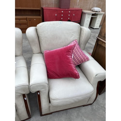 2945 - A CREAM LEATHER THREE PIECE SUITE COMPRISING OF THREE SEATER SETTEE AND TWO EASY CHAIRS