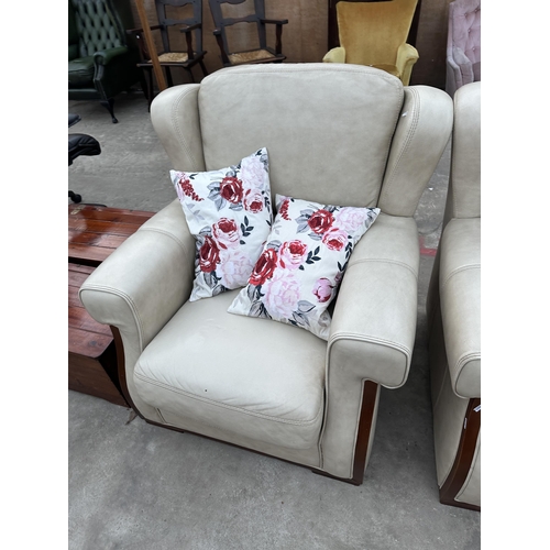 2945 - A CREAM LEATHER THREE PIECE SUITE COMPRISING OF THREE SEATER SETTEE AND TWO EASY CHAIRS