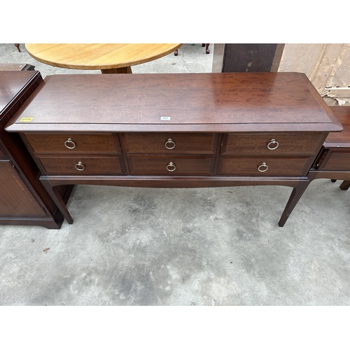 2951 - A STAG MINSTREL DRESSING TABLE ENCLOSING SIX DRAWERS, 52