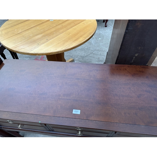 2951 - A STAG MINSTREL DRESSING TABLE ENCLOSING SIX DRAWERS, 52