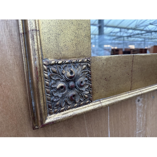 2975 - A 19TH CENTURY GILT FRAMED WALL MIRROR WITH CORNER FOLIATE DECORATION, 38