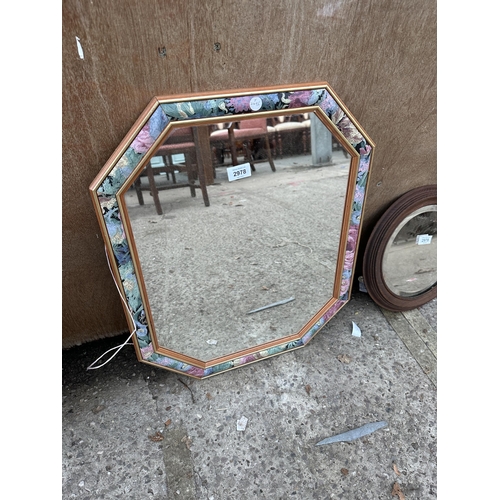 2978 - A WALL MIRROR WITH FLORAL EDGE