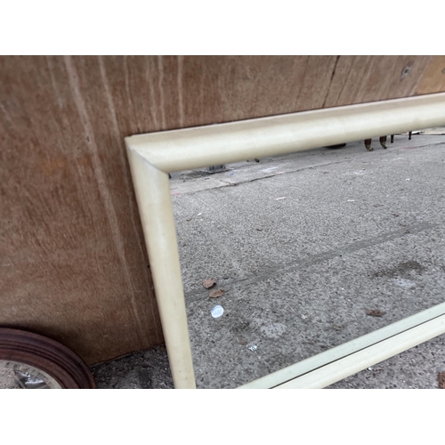 2980 - A WOODEN FRAMED CREAM MIRROR, 40