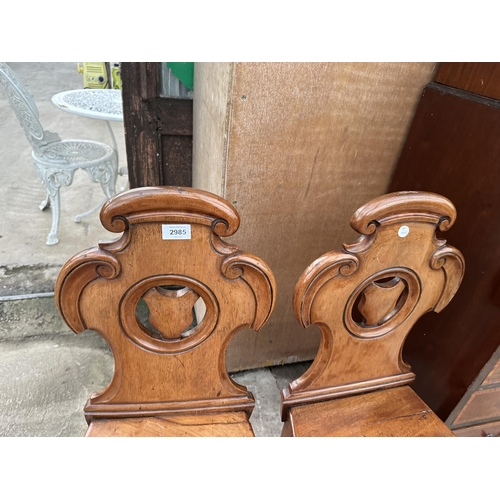 2985 - A PAIR OF VICTORIAN MAHOGANY SHIELD BACK HALL CHAIRS ON TURNED FRONT LEGS