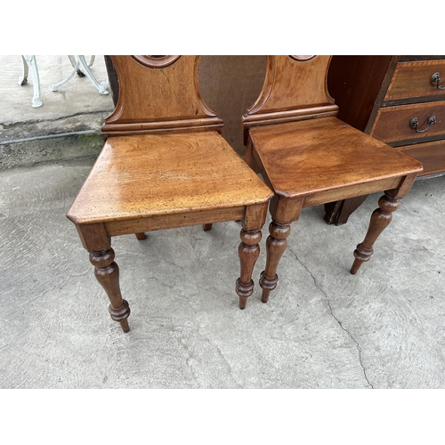 2985 - A PAIR OF VICTORIAN MAHOGANY SHIELD BACK HALL CHAIRS ON TURNED FRONT LEGS