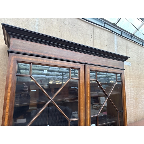 2986 - AN EDWARDIAN MAHOGANY AND INLAID ABSTRACT GLAZED TWO DOOR BUREAU BOOKCASE 38