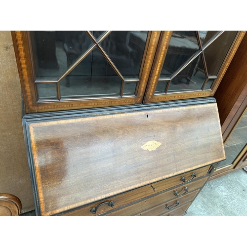 2986 - AN EDWARDIAN MAHOGANY AND INLAID ABSTRACT GLAZED TWO DOOR BUREAU BOOKCASE 38