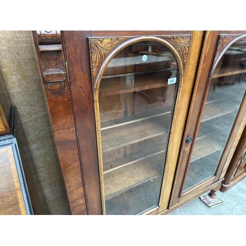 2987 - A VICTORIAN MAHOGNAY ARCHED TWO DOOR GLAZED BOOKCASE ON CABRIOLE LEGS  46