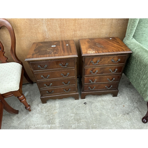 2993 - A PAIR OF SMALL MAHOGANY CROSS BANDED CHESTS OF FOUR DRAWERS 17.5