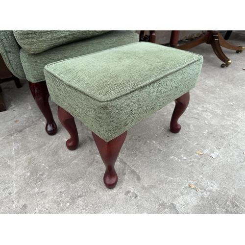 2994 - AN HSL WINGED FIRESIDE CHAIR AND STOOL ON CABRIOLE LEGS