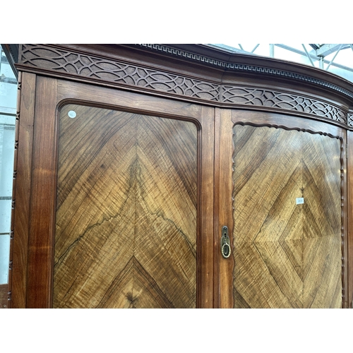 2930 - AN EDWARDIAN MAHOGANY AND WALNUT WARDROBE WITH TWO HANGING COMPARTMENTS, CENTRAL CUPBOARD AND FOUR D... 