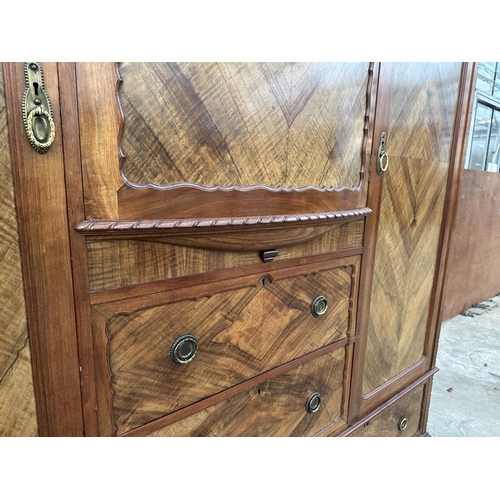 2930 - AN EDWARDIAN MAHOGANY AND WALNUT WARDROBE WITH TWO HANGING COMPARTMENTS, CENTRAL CUPBOARD AND FOUR D... 