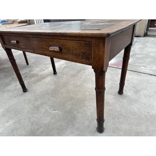 2931 - AN EARLY 20TH CENTURY OAK OFFICE TABLE WITH TWO DRAWERS BEARING LABEL 'THE NORTH OF ENGLAND SCHOOL F... 