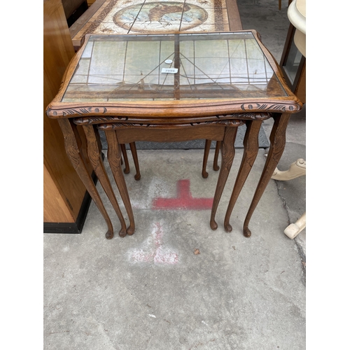 2899 - A MODERN NEST OF THREE WALNUT TABLES ON CABRIOLE LEGS..