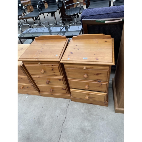 2914 - A PAIR OF PINE THREE DRAWER BEDSIDE CHESTS WITH PULL OUT SLIDES