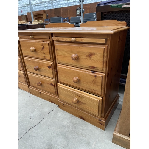 2914 - A PAIR OF PINE THREE DRAWER BEDSIDE CHESTS WITH PULL OUT SLIDES