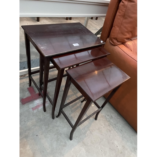 2919 - A NEST OF MAHOGANY TABLES