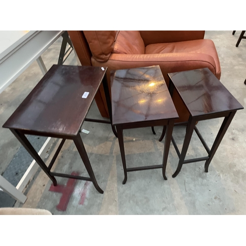 2919 - A NEST OF MAHOGANY TABLES