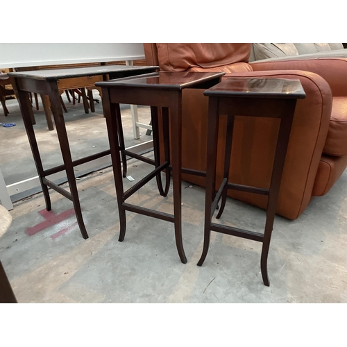 2919 - A NEST OF MAHOGANY TABLES