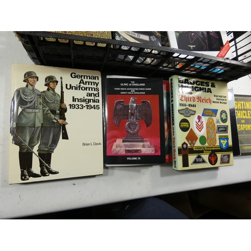 345 - A COLLECTION OF SIXTEEN BOOKS ON NAZI GERMANY DURING WORLD WAR II, SUBJECTS TO INCLUDE NAZI BADGES, ... 