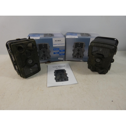 411 - TWO BOXED HC-800A, DIGITAL TRAIL CAMERAS COMPLETE WITH INSTRUCTIONS, BELIEVED TO BE WORKING