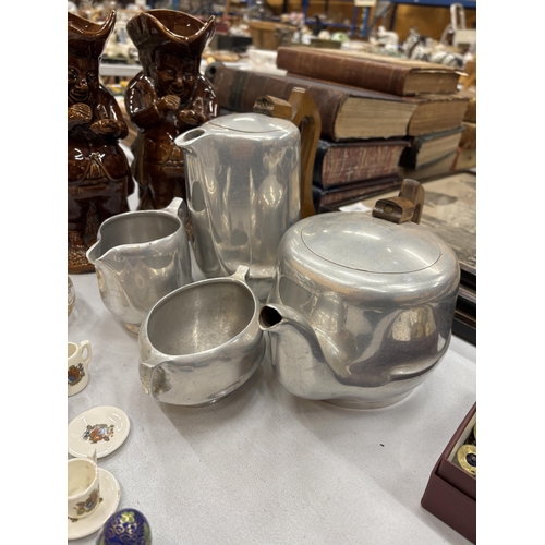 119 - A VINTAGE PICQUOT WARE TEASET TO INCLUDE A TEAPOT, HOT WATER POT, CREAM JUG AND SUGAR BOWL