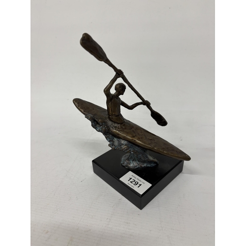 1291 - A BRONZE CANOEIST SCULPTURE ON A PEDESTAL