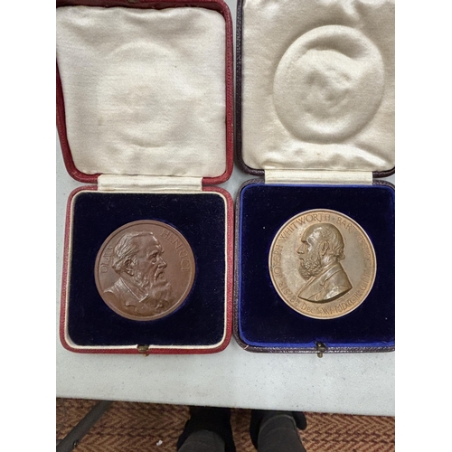 1295 - TWO VINTAGE BRONZE BOXED MEDALS