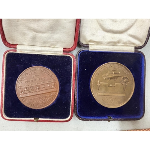 1295 - TWO VINTAGE BRONZE BOXED MEDALS