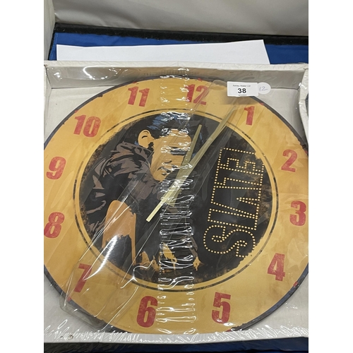 1317 - AN AS NEW AND BOXED ELVIS WALL CLOCK