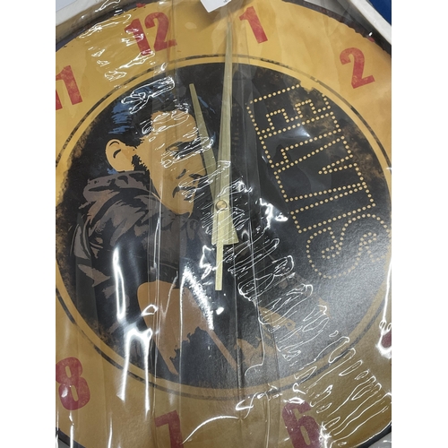 1317 - AN AS NEW AND BOXED ELVIS WALL CLOCK