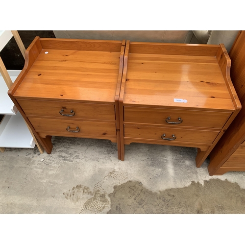 3015 - A PAIR OF PINE BEDSIDE CHESTS AND FIVE CUSHIONS