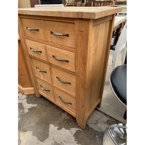 3021 - AN OAK CHEST OF FOUR DRAWERS AND A CORNER T.V STAND