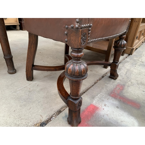 3028 - AN OAK JACOBEAN STYLE TUB CHAIR ON BULBOUS FRONT LEGS.