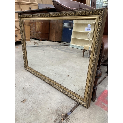 3029 - A GILT FRAMED WALL MIRROR, 40