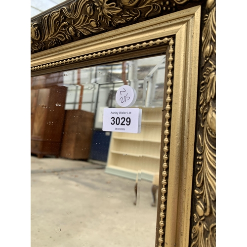 3029 - A GILT FRAMED WALL MIRROR, 40