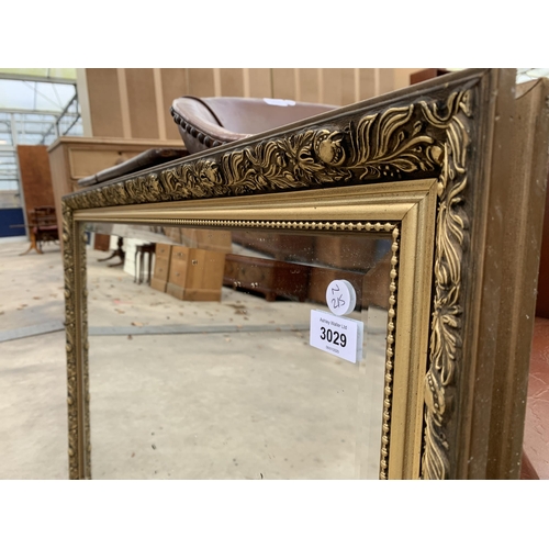 3029 - A GILT FRAMED WALL MIRROR, 40