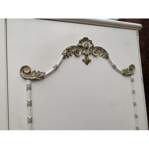 3030 - A CREAM AND GILT TWO DOOR WARDROBE , 45