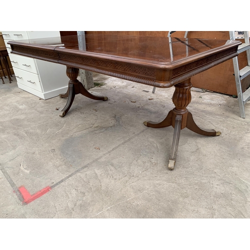 3032 - A REGENCY STYLE TWIN-PEDESTAL DINING TABLE