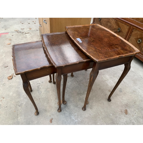 3034 - A WALNUT NEST OF THREE TABLES