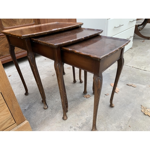 3034 - A WALNUT NEST OF THREE TABLES