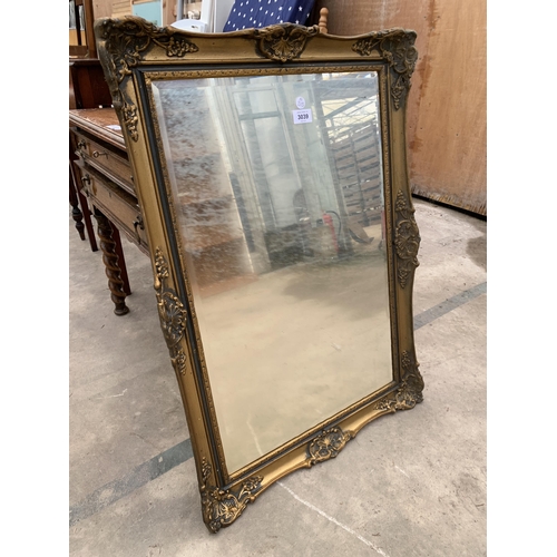 3039 - A GILT WALL MIRROR, 31