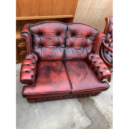 3060 - AN OXBLOOD TWO SEATER SETTEE.