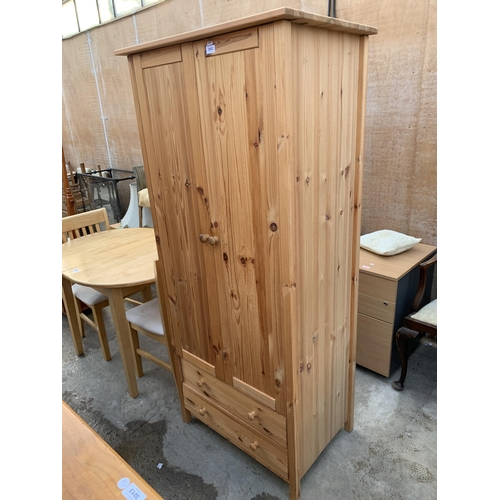 3062 - A PINE TWO DOOR WARDROBE WITH TWO DRAWERS TO BASE, 31