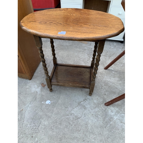 3067 - AN EARLY 20TH CENTURY OAK OCCASIONAL TABLE ON BARLEY LEGS , 26