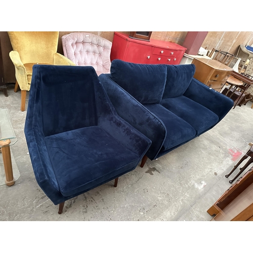 3073 - A MODERN BLUE TWO SEATER SETTEE AND MATCHING CHAIR ON TAPERING LEGS.