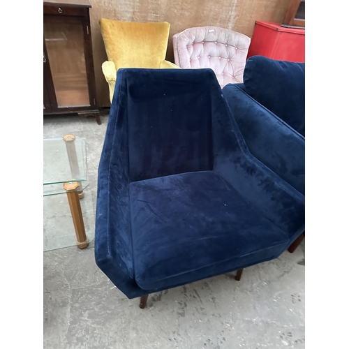 3073 - A MODERN BLUE TWO SEATER SETTEE AND MATCHING CHAIR ON TAPERING LEGS.