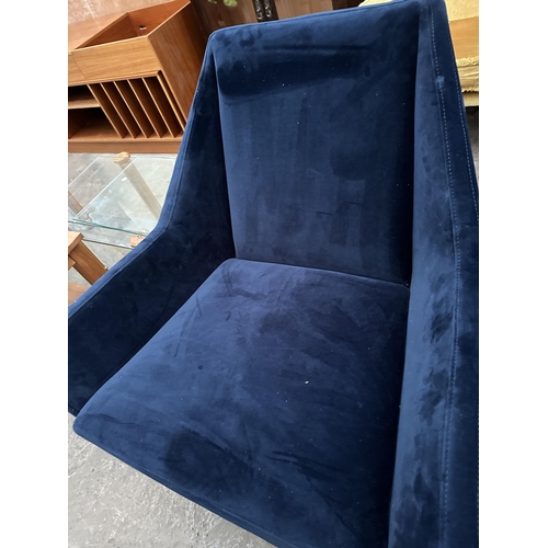 3073 - A MODERN BLUE TWO SEATER SETTEE AND MATCHING CHAIR ON TAPERING LEGS.