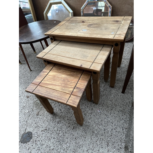 3084 - A NEST OF THREE MEXICAN PINE TABLES, A COFFEE TABLE AND A SMALL TWO DRAWER CHEST.